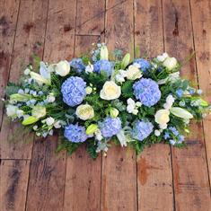 Light blue casket spray 