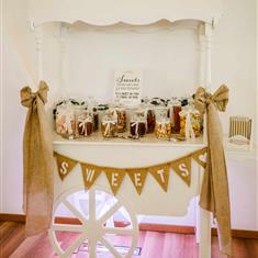 White wooden sweet cart
